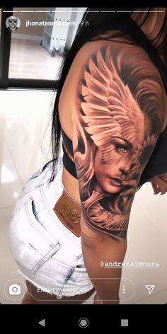 a woman's arm with a tattoo on it and an eagle in the middle