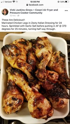 chicken wings in a white dish on top of a stove with an instagramt