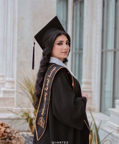 a woman wearing a graduation cap and gown