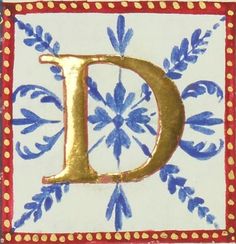 the letter d is decorated with blue flowers and gold dots on white tiles, along with red trimmings