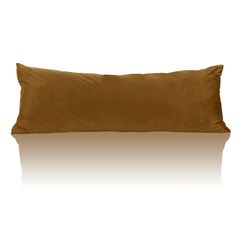 a brown pillow sitting on top of a white floor