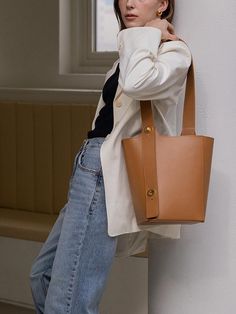 For unique designs and high-quality products, REFRAME pursues craftsmanship through the entire domestic handmade process.- Two-way bucket bag made of Italy leather- Can be worn in two ways: shoulder or cross bag- Gold satin turn lock and saltledge decoration- Durable bag with generous size Rectangular Brown Bucket Bag For Work, Cognac Bucket Shoulder Bag, Light Brown Bucket Tote Bag For Shopping, Light Brown Tote Bucket Bag For Shopping, Brown Leather Bucket Bag For Work, Brown Bucket Bag With Detachable Handle For Work, Cognac Bucket Bag For Daily Use, Cognac Bucket Bag For Travel, Light Brown Shoulder Bucket Bag For Shopping