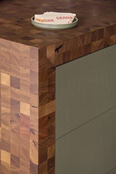 a bowl sitting on top of a wooden counter