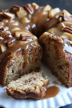 a bundt cake with pecans and caramel drizzled on top