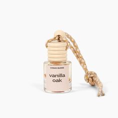 a bottle of vanilla oak cologne sitting on top of a rope