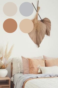 a bed room with a neatly made bed and some decorative items hanging on the wall