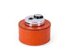 This table lighter features a handcrafted rounded wood base, luxuriously covered in orange embossed leather, making it a vibrant detail with an expressive texture. Refillable Lighter, Table Lighter, Leather Table, Handcrafted Wood, Handcrafted Leather, Alfa Romeo, Light Table, Home Decor Items, Household Items