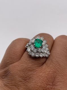 Stunningly gorgeous, Emerald & Diamond Ring set in Platinum. Handmade. Beautiful quality piece of jewelry. Approximately 2.20 ct. in Diamonds, Emerald is nice color & measures 1.15 ct. Diameter of ring is 19mm, size 6 but can be sized. Circa 1950's Elegant Cluster Diamond Emerald Ring, Elegant Cluster Emerald Diamond Ring, Elegant Emerald Cluster Ring With Diamonds, Elegant Cluster Emerald Ring With Diamonds, Luxury Cluster Emerald Ring With Diamonds, Elegant Cluster Emerald Ring With Brilliant Cut, Green Brilliant Cut Diamond Gemstones, Cluster Diamond Gemstones For Wedding, Classic Emerald Gemstones For Wedding