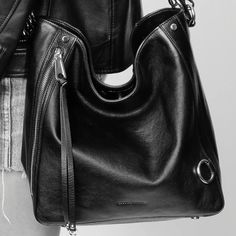 The M.A.B. Hobo Bag: your new go-to for carrying it all, with room for your laptop and more! Crafted in soft black leather with sleek black hardware. Wear it as a crossbody to lighten your load. 11.5" W X 8" H X 4" D Detachable Strap: Strap Drop 15" Handle Drop: 8" Zipper Closure 2 Exterior Zip Pockets 1 Interior Zip Pocket Bag Feet Modern Hobo Shoulder Bag For On-the-go, Luxury Everyday Hobo Bag With Zipper Closure, Leather Flap Shoulder Bag With Gunmetal Hardware, Leather Shoulder Bag With Gunmetal Hardware, Luxury Hobo Bag With Zipper Closure For Everyday, Soft Leather Hobo Bag For On-the-go, Leather Hobo Bag For On-the-go, Luxury Hobo Shoulder Bag With Gunmetal Hardware, Trendy Leather Shoulder Bag With Gunmetal Hardware