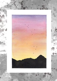 a watercolor painting with birds flying in the sky at sunset or sunrise over mountains