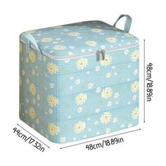 a blue and white flower pattern storage box