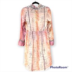 This Vintage V Neck Johnny Was Dress Is Stunning. Tags Still On! A Cream, Pink & Orange Background Flatters Every Skin Tone. Elasticized At The Waist & Ultra Soft & Airy Make This A Real Easy Dress To Wear The Colors Are Stunning. 3 Buttons At The Vneck For Decoration And Embroidered Eyelet Like Floral Detail. A Dream To Wear Host Pick For Boho Party 12- 10 Thank You @Mk_gypsy_fairy. Fairycore Boho Spell Gypsy Cottagecore Barbiecore Barbie Pink Summer Fall Wedding Wedding Guest Coastal Cowgirl Country Orange Long Sleeve Dress With Floral Embroidery, Festive Floral Print Orange Dress, Festive Orange Floral Print Dress, Spring Bohemian Embellished Midi Dress, Bohemian Spring Embellished Midi Dress, Bohemian Embellished Midi Dress For Spring, Orange Bohemian Dress For Daywear, Bohemian Orange Dress For Daywear, Embellished Tunic Dresses For Spring