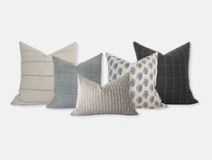 four pillows in different colors and patterns