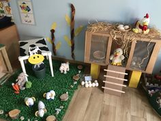 a room with toys and fake grass on the floor