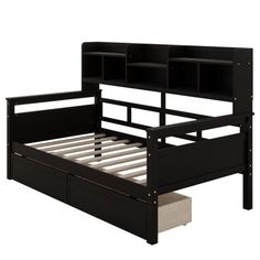 a black bed frame with drawers underneath it