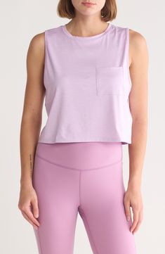 Show off those hard-earned muscles in a bicep-exposing top cut from supersoft, breathable fabric enhanced with easy-moving stretch. 19" length Crewneck Sleeveless Chest patch pocket 90% recycled polyester, 10% spandex Machine wash, tumble dry Imported Purple Sleeveless Top For Light Exercise, Sleeveless Sportswear Crop Top For Light Sports, Spring Medium Support Tank Top For Training, Spring Athleisure Tops For Training, Functional Tops For Training In Spring, Spring Sports Purple Top, Spring Athleisure Training Tops, Compressive Sports Top For Spring, Spring Training Athleisure Tops