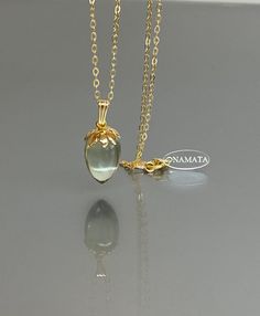 Step into a world of elegance and sophistication with our 14K gold-filled green amethyst necklace. The captivating green amethyst pendant necklace showcases the natural beauty of this exquisite gemstone. This amethyst necklace offers a simple and refined aesthetic, making it a versatile accessory for any occasion. Add a touch of elegance to your ensemble with this amethyst pendant necklace, featuring a delicate gold chain that perfectly complements the beauty of the gemstone. * Quality: Hight Qu Elegant Yellow Gold Chalcedony Necklaces, Green Amethyst Gemstone Necklace, Gift Gold Necklaces With Green Amethyst, Gift Green Amethyst Gold Necklaces, Gold Necklace With Green Amethyst Gemstone, Luxury Green Amethyst Jewelry As Gift, Oval Green Amethyst Gold Jewelry, Luxury Green Amethyst Jewelry Gift, Amethyst Pendant Necklace