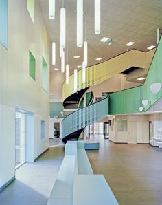 the interior of a building with stairs and lights