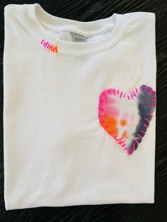 a t - shirt with a heart painted on it