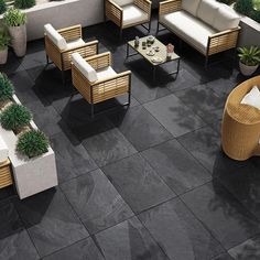 an aerial view of a patio with seating and potted plants