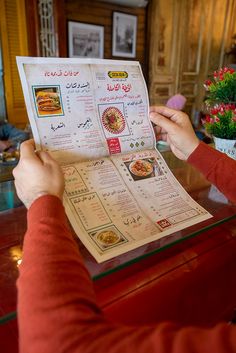 a person is reading a menu at a restaurant