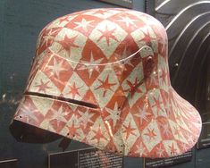 an old helmet on display in a museum