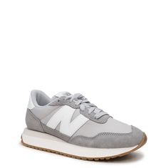 Versatile and trendy, these women's New Balance 237 marblehead/raincloud (grey) running shoes are a modern uptake on 70s running heritage design. Featuring a streamlined silhouette with unbacked suede and mesh upper, these athleisure sneakers have an oversized N branding on the side for a modern look, extended midsole length, gator inspired foxing, asymmetrical rubber tip wrap and mudguard for extra protection. An exposed foam tongue and EVA midsole provide lightweight comfort while a large scal Gray Leather Running Shoes With Translucent Outsole, Gray Leather Sneakers For Jogging, Gray Running Shoes With Contrast Sole For Jogging, Sporty Gray Running Shoes With Contrast Sole, Gray Sneakers With Contrast Sole For Jogging, Gray Sneakers For Jogging With Contrast Sole, Gray Running Shoes With Translucent Outsole For Jogging, Gray Running Shoes With Contrast Sole, Gray Leather Athleisure Sneakers