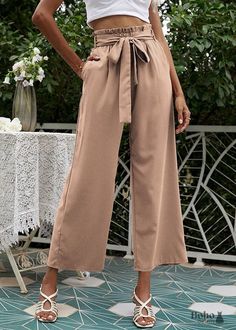 High waisted wide-leg pants in a boho style With its tassels and openwork embroidery, we adore these High Waisted Boho Pants. Its loose fit gives you a sense of liberation and independence. You may achieve a stunning boho chic appearance by pairing it with a crop shirt and heeled sandals. Not sure what size to choose? Take your measurements and refer to the chart below. Size (cm) S M L Waist 64 68 72 Hips 104 108 112 Length 102.5 104.5 106.5 Fabric: polyesterFit: wide legDetails: stretchy waistb Orange Wide Leg Pants, Paper Bag Trousers, Trousers Wide Leg, Bohemian Style Clothing, High Waisted Wide Leg Pants, Wide Leg Crop Pants, Boho Style Outfits, Cotton Linen Pants, Casual Wide Leg Pants