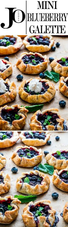 several blueberry pies are arranged on a baking sheet