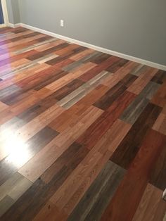 an empty room with hard wood flooring in it