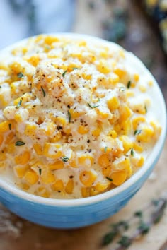 a bowl filled with macaroni and cheese on top of a table