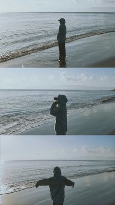 the man is standing on the beach looking at the water and taking pictures with his cell phone