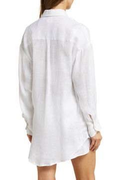 This oversized cover-up shirt woven from lightweight linen is a must-pack companion for your next sunny getaway. 32 1/2" length (size Medium)   Front button closure   Spread collar   Long sleeves with button cuffs   Curved high-low hem   100% linen   Hand wash, dry flat   Imported   As a member of 1% for the Planet, Vitamin A has committed to donating 1% of its annual sales to nonprofit partners in support of environmental solutions Linen Button-up Blouse For Vacation, Button-up Linen Blouse For Vacation, Beach Long Sleeve Linen Tops, Linen Long Sleeve Beach Top, Long Sleeve Linen Tops For Beach, Chic Linen Beach Shirt, Chic Linen Shirt For Beach, Chic Linen Shirt For The Beach, Relaxed Long Sleeve Shirt For Vacation