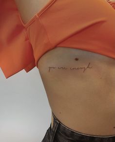 a woman's stomach with the words you are sorry written on it