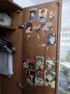 an open closet door with pictures on it