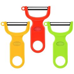 three different colored scissors with handles on white background