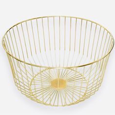 a gold wire basket with a circular handle