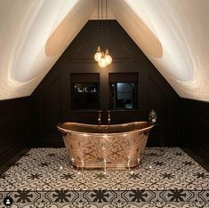 an ornate bathtub in the corner of a room