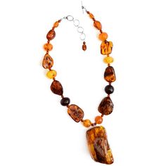 Polish Ddigner masterpiece! The centerpiece stone has so much depth of beautiful colors developed over millions of years. All Baltic Amber! Stones: Amber Length: Adjustable length approx. 17" - 19" Width: Center amber piece approx. 2 1/4" long x 1 1/4" wide and is approx. 1" thick (depth) Material: .925 Silver Made in: USA Amber Stone, Baltic Amber, Stone Necklace, Sterling Silver Necklaces, Cognac, Poland, Beautiful Colors, 925 Silver, Amber