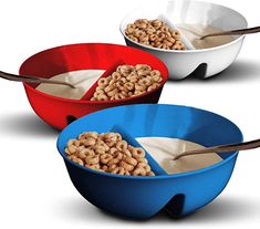 three cereal bowls with spoons in them