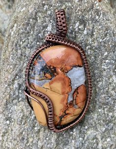 Like a bright summer day! Bright and Colorful Maligano Cabochon wrapped in hand woven Copper.  An original Monkeylion Design. Approximately 2 1/8" long and 1 1/8" wide.  This pendant could be paired with these earrings: https://monkeyliondesigns.com/products/maligano-jasper-and-woven-copper-earrings  This pendant has been antiqued, polished and sealed. Brown Artsy Jewelry For Gifts, Handmade Rectangular Artsy Jewelry, Hand Wrapped Rectangular Bohemian Jewelry, Bohemian Hand Wrapped Rectangular Jewelry, Handmade Brown Rectangular Jewelry, Handmade Rectangular Nature-inspired Jewelry, Handmade Multicolor Jasper Jewelry, Artisan Brown Hand-wrapped Jewelry, Handmade Artsy Collectible Jewelry