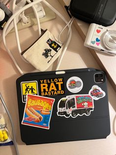 there is a cell phone and some stickers on the table