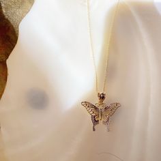 Give her the gift of wings with this beautiful butterfly necklace. DETAILS - 14k yellow gold butterfly with rhodium plating - Chain option is a 14k yellow gold cable chain - Chain style may vary slightly - Approximately 13/16 inch wide x 7/8 inch tall (including bail) VARIATIONS If you require any variation of this style (a different style chain, longer chain, etc.) feel free to message us. We will do our best to accommodate you. Additional costs may apply depending on the variation. POLICY We d Elegant Butterfly Charm Jewelry, Elegant Wing-shaped Butterfly Charm Jewelry, Elegant Wing-shaped Jewelry With Butterfly Charm, 14k Gold Butterfly Necklace Fine Jewelry, 14k White Gold Butterfly Charm Necklace, 14k White Gold Necklace With Butterfly Charm, 14k Gold Butterfly Charm Pendant Necklace, 14k Gold Butterfly Necklace Pendant, Yellow Gold Butterfly Necklace With Butterfly Clasp