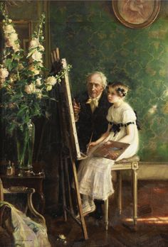 an old man and woman sitting in front of a easel with flowers on it