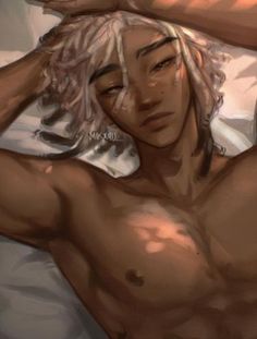 a man with blonde hair laying in bed