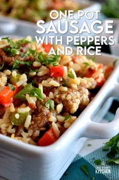 one pot sausage with peppers and rice in a white casserole dish on a table