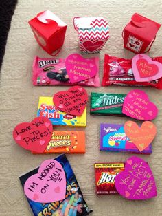 valentine's day candy and candies laid out on a bed