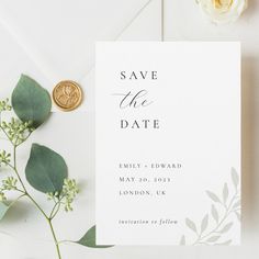 save the date card with wax stamp and greenery