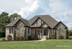 a large house in the middle of a green field