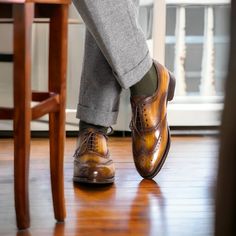 Handmade in 7 days. Made in Spain This beautiful cognac patina finish is all made by hand. Not only is the shoe hand sewn, but the finish is hand rubbed to achieve that antique coloration of slight burnishing rubbed into the patina. A classic wing tip style lace up, the full brogue has the perforated medallion on the toe box. Great for spring, summer and fall with suits, trousers and jeans. Brown Leather Wingtip Shoes With Goodyear Welt, Brown Goodyear Welted Leather Wingtip Shoes, Brown Goodyear Welted Wingtip Dress Shoes, Timeless Italian Wingtip Oxfords, Cognac Wingtip Oxfords With Leather Sole, Cognac Goodyear Welted Wingtip Leather Shoes, Brown Italian Wingtip Dress Shoes, Timeless Brown Wingtip Oxfords, Brown Italian Wingtip Leather Shoes